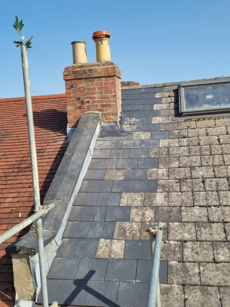 A tiled roof being repaired